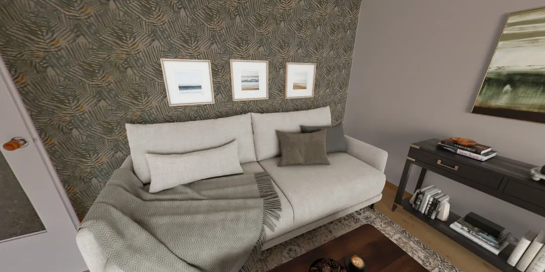 Pokój po aranżacji – sofa z poduszkami i obrazy na ścianie